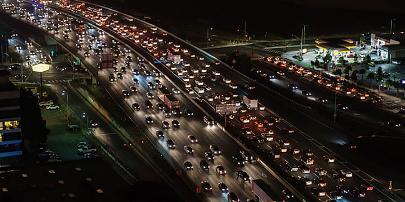 A busy motorway or freeway from afar, at night